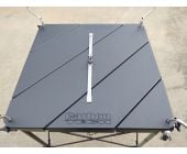 Carbon Tech Hood Stand hard top panel with adjustable deck lid rail installed on a stand, black segmented surface real world usage photo.