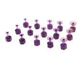 Fifteen purple Dent Reaper Dead Center hexagonal glue tabs in mixed sizes from 8 mm to 16 mm arranged on a white background.