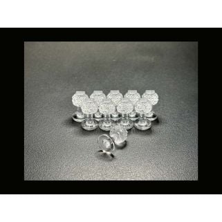 Dent Lab Hail Stone 13mm clear PDR glue tabs, 10-pack on black surface with one tab on its side.