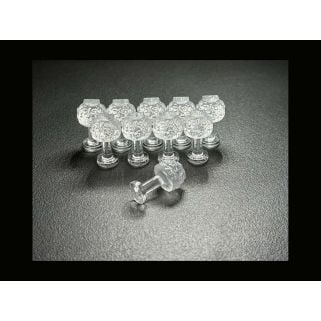 Dent Lab Hail Stone 9mm clear PDR glue tabs, 10-pack on black surface with one tab on its side.