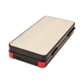 Compact rectangular Elimadent X-Factor Flip Light showing white diffusion lens, black housing, and red rubber corner bumpers.