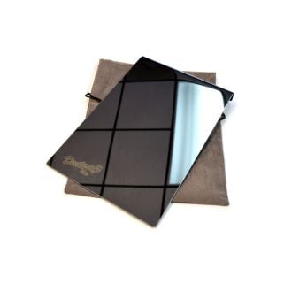 Mirror finish stainless window shield with 1.5-inch flange, resting on its gray carry pouch, on a white background.